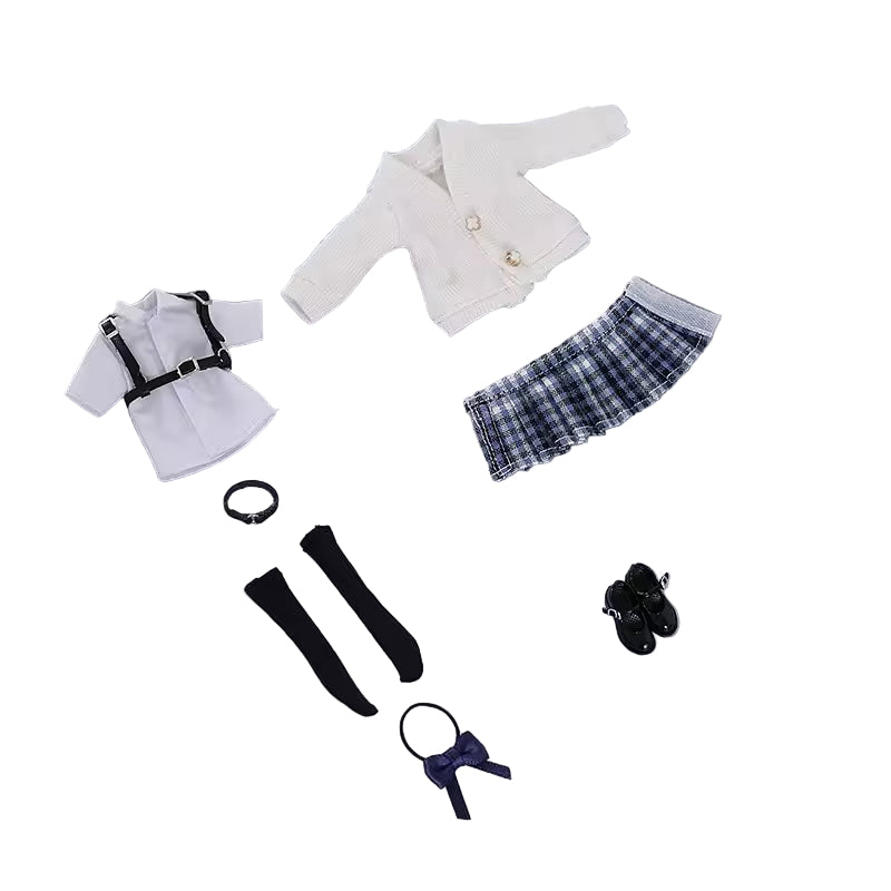 Collection of doll clothes and accessories on a gray background with