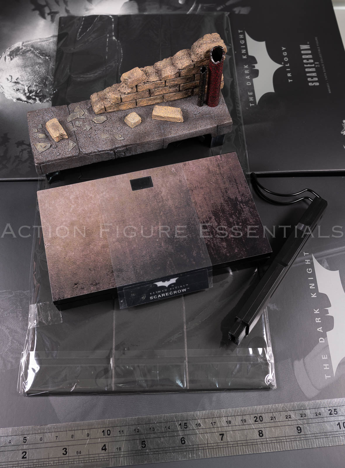 Hot Toys Scarecrow 2.0 MMS801 city sewer diorama display set with weathered brick wall, pipes, rubble, display base and printed backdrop