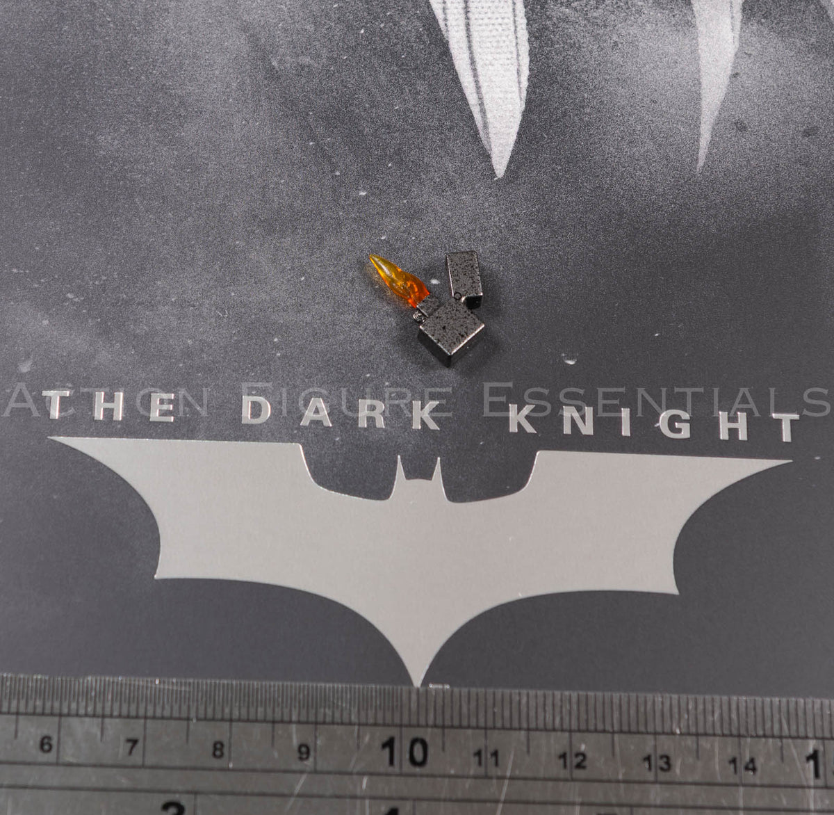 Hot Toys Scarecrow 2.0 MMS801 miniature open lighter with metallic-style finish and translucent orange flame effect for 1/6 scale figure