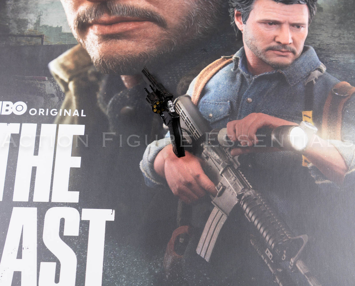 Hot Toys Joel Miller black revolver in 1/6 scale, showing textured grip, detailed cylinder, barrel and subtle worn highlights