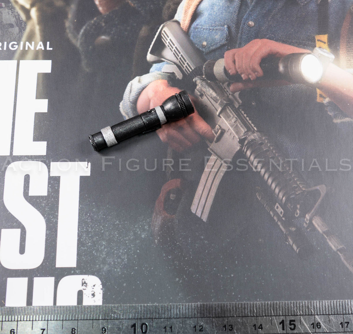 Hot Toys Joel Miller 1/6 scale torch with shaped black body and contrasting silver-coloured detailing