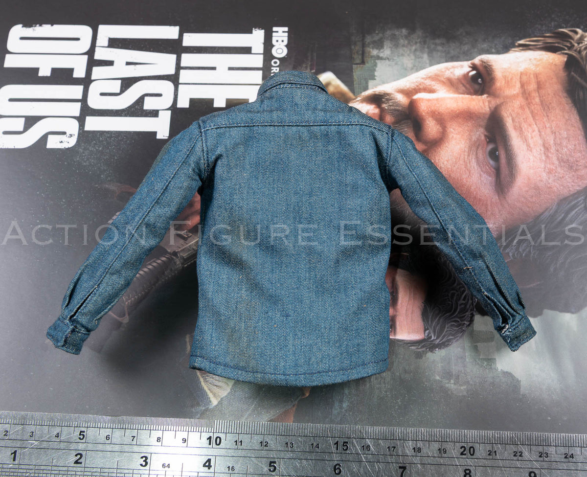 Rear view of Hot Toys Joel Miller blue denim shirt in 1/6 scale, showing shoulder panels, fine stitching and curved hem