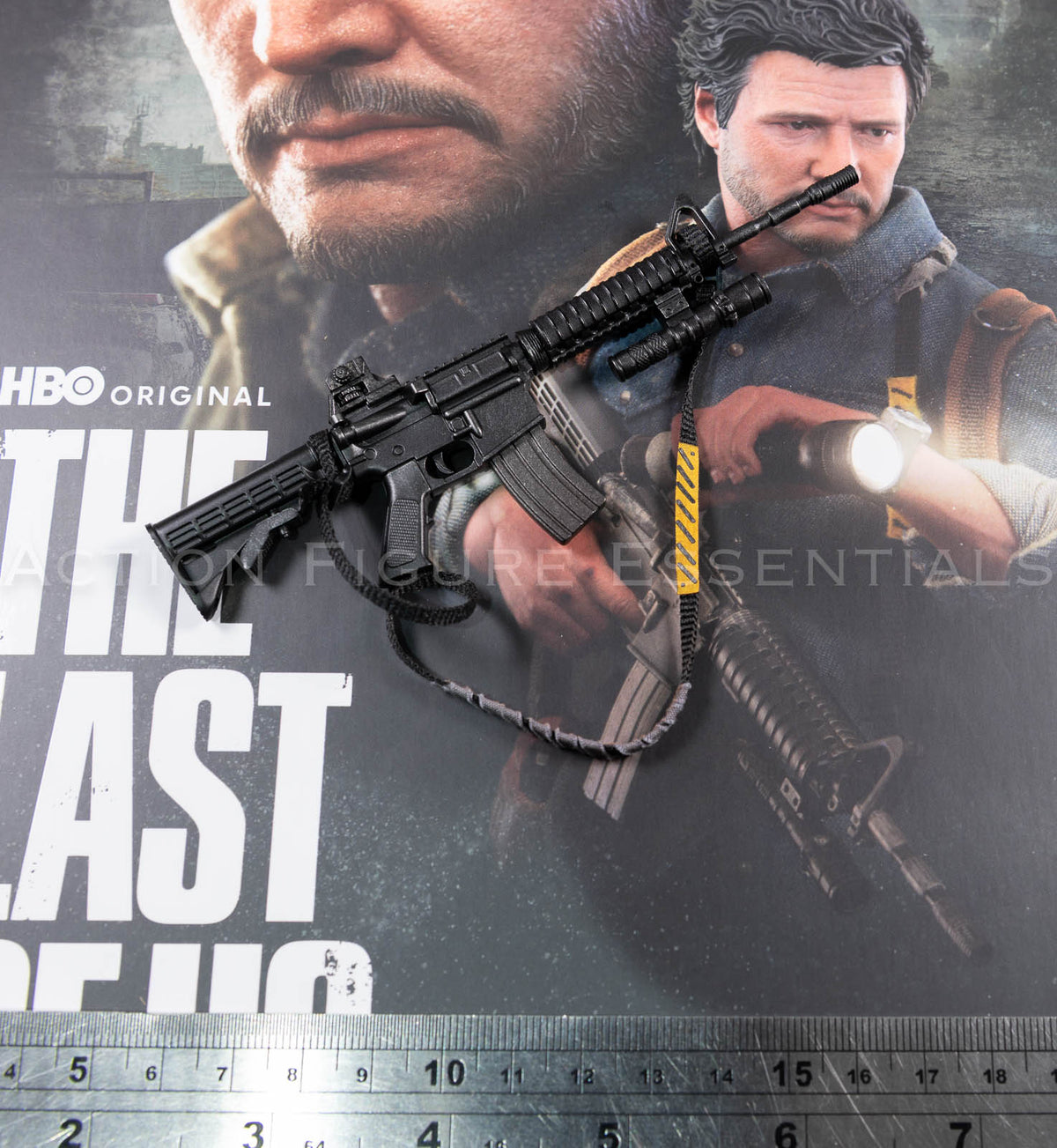 Hot Toys Joel Miller 1/6 scale assault rifle with fabric sling, yellow strap detailing, mounted torch and removable magazine