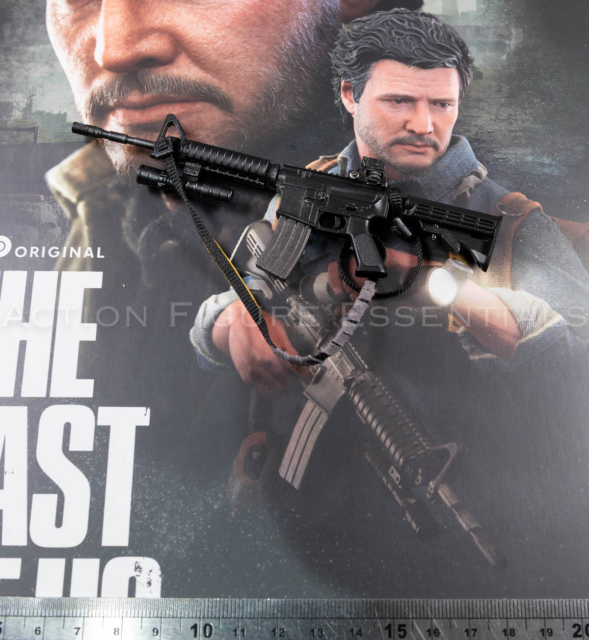 Hot Toys Joel Miller 1/6 scale assault rifle with fabric sling, yellow strap detailing, mounted torch and removable magazine