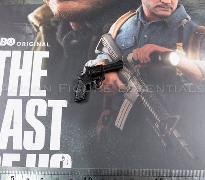 Hot Toys Joel Miller black revolver in 1/6 scale, showing textured grip, detailed cylinder, barrel and subtle worn highlights
