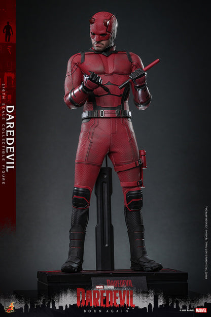 Statue of Daredevil in red and black suit on a gray background